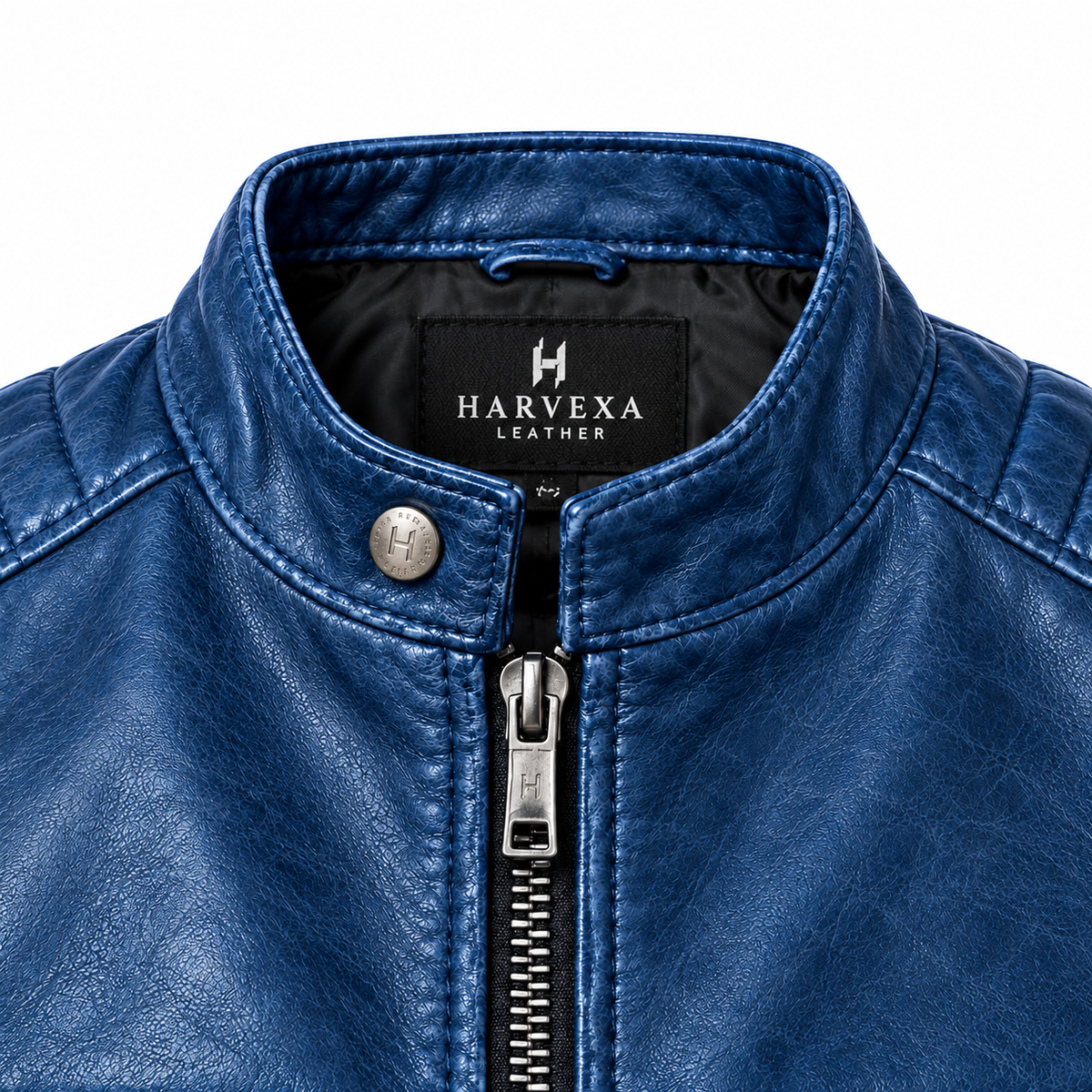 Close-up of a blue leather jacket collar with premium textured leather, silver zipper hardware, and detailed stitching.