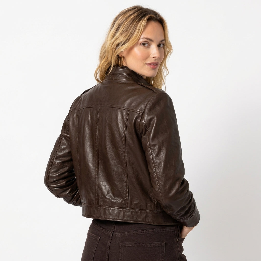 Classic dark brown women's leather jacket with a fitted silhouette, styled for an elegant