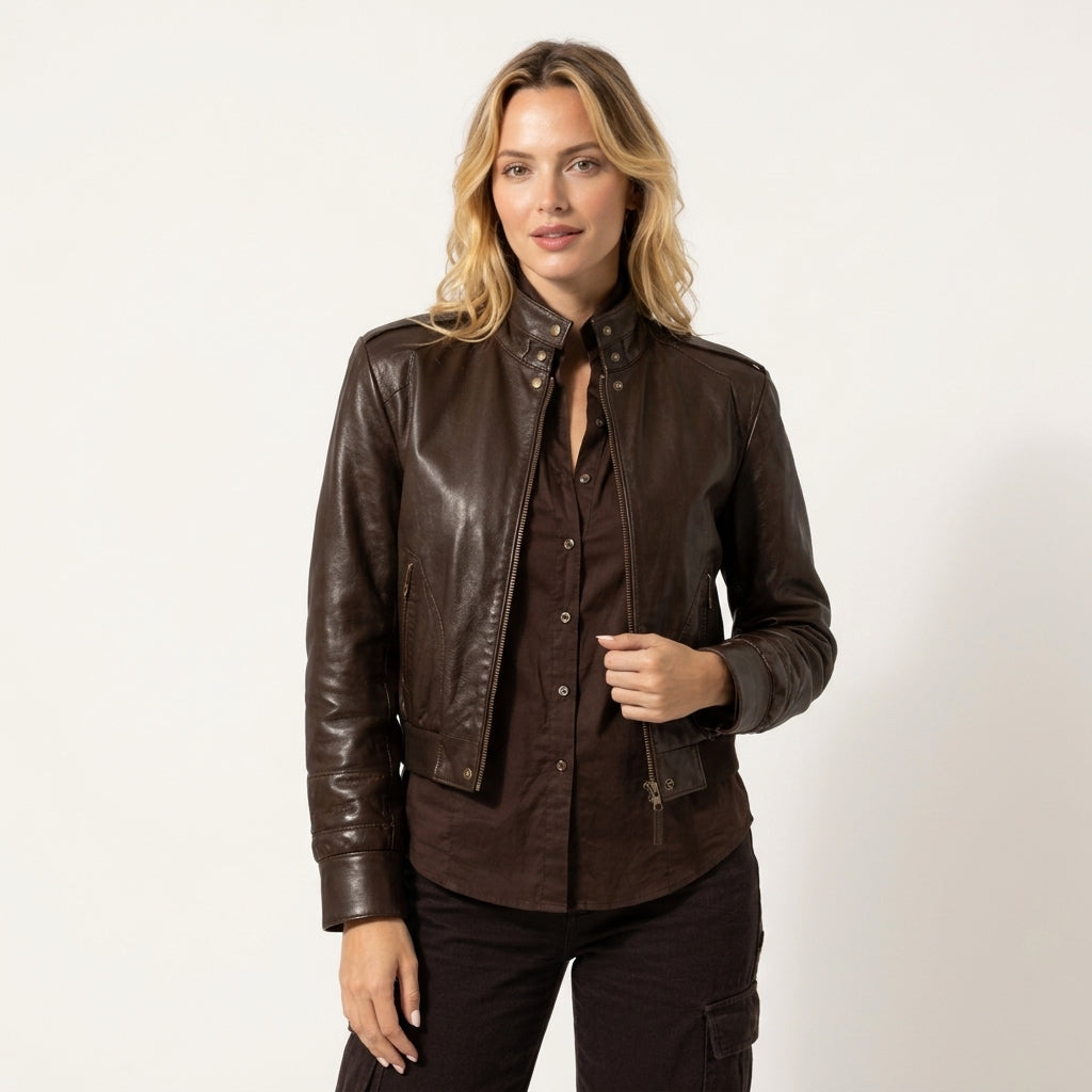 brown women's leather jacket featuring a snap-button collar, front zipper pockets, and stylish stitching details